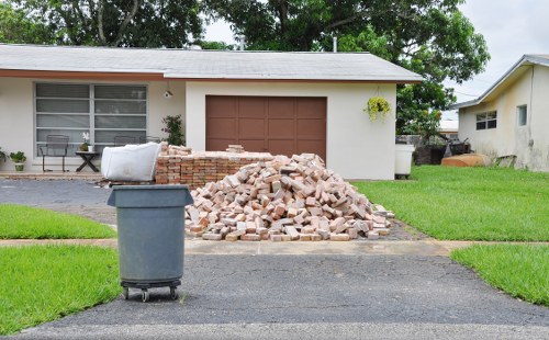 Inspector speaking with waste removal staff during a site visit